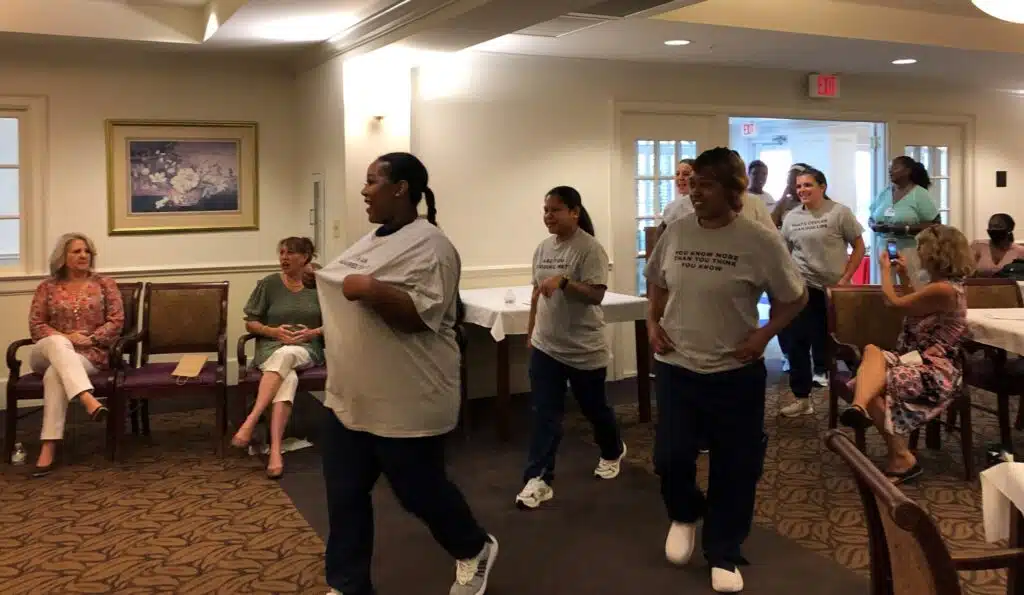 Virginia Health Services apprentices surprise instructor Nora Gillespie with T-shirts