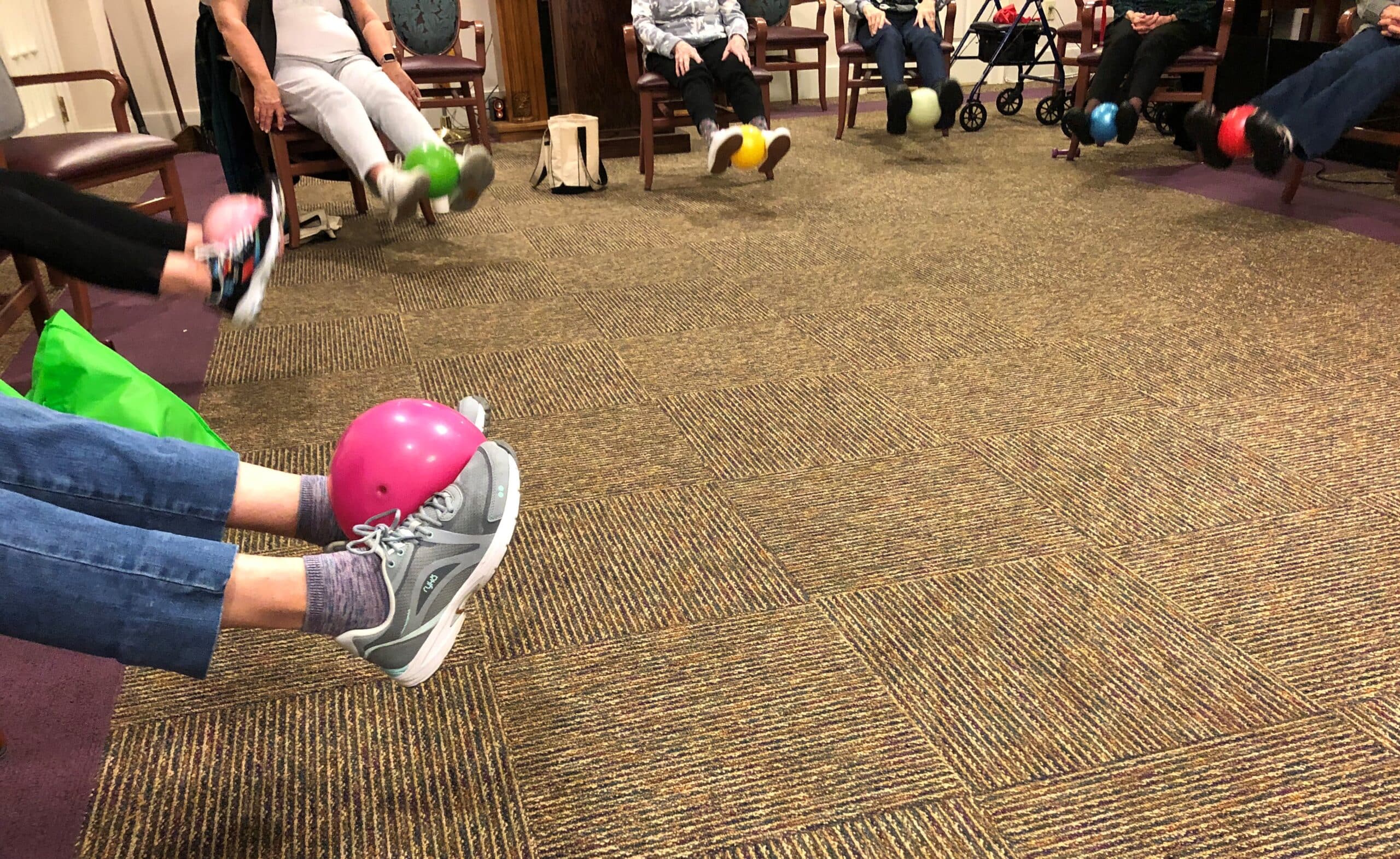 A VHS Rehabilitation tech helps residents at The Arbors Independent Living keep up their strength with daily 30-minute chair exercise classes.