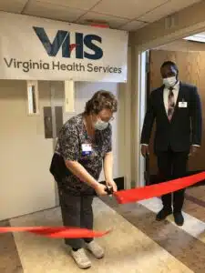 DON Lana Ketch cuts the red ribbon to open the Memory Care unit expansion