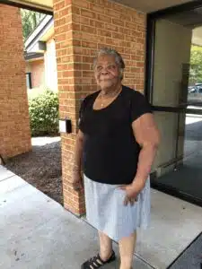 Mary Jones stands outside the front door of Northampton Nursing and Rehabilitation Center.