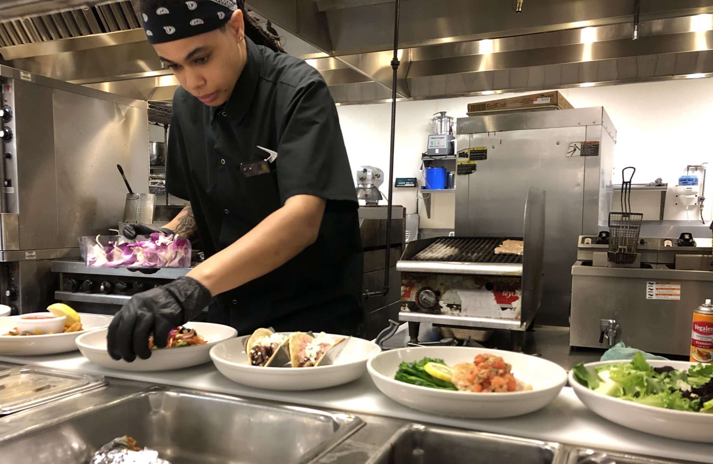 Chef Akira Johnston prepares meals in kitchen at The Arbors Independent Living.