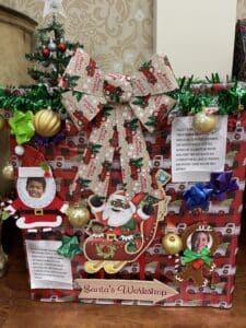 donation box decorated for Christmas in the Coliseum lobby