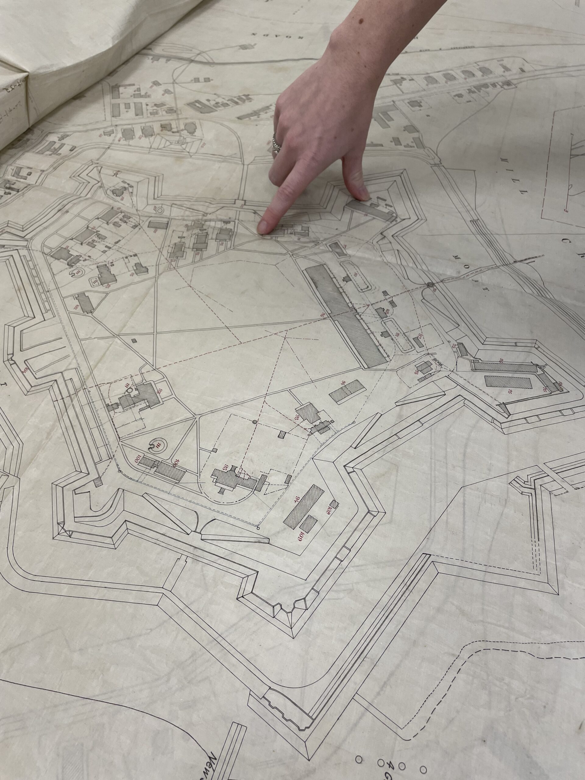 On a map of Fort Monroe during the time of Reconstruction after the Civil War, Fort Monroe archivist Ali Kolleda points out where the Post Hospital and matrons' quarters were upon entering the fort's main gate.