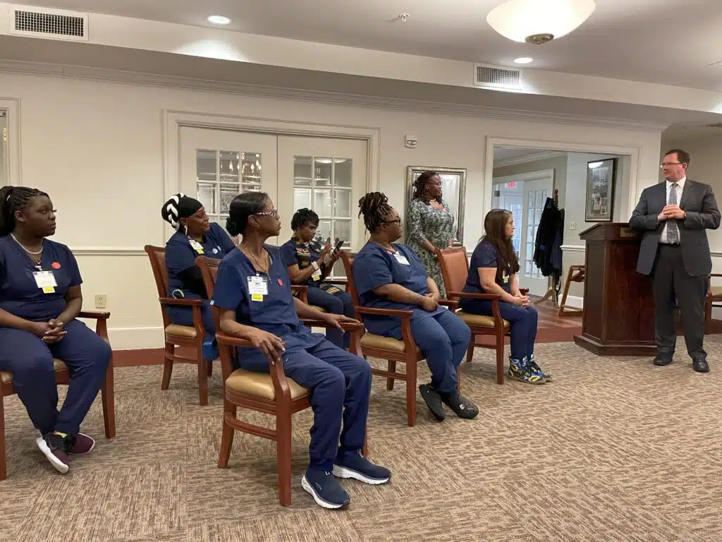 Virginia Health Services CEO Mark Klyczek addresses the April 2023 apprentices during a ceremony at The Arbors.