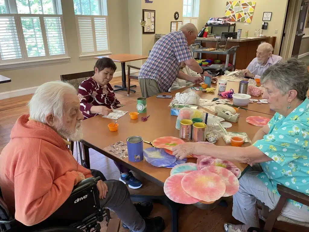 Martha and Jerry Dodson help Huntington Residents with a spring craft during their April visit.