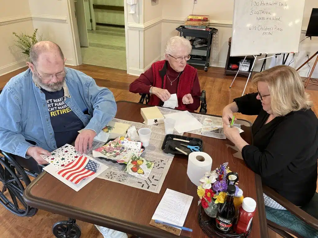 Bob and Alvera with her daughter Pam at an art activity at York.