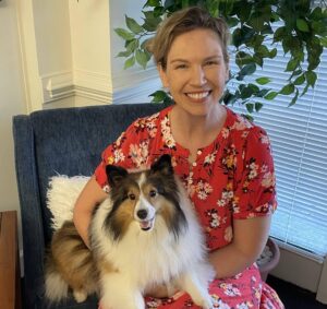 Portrait of Director of Operations for VHS Home Health Care and VHS Hospice Ariane Minette, with her dog Darby.