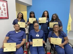 Graduation photo of seven students in the apprenticeship program June 6, 2024.