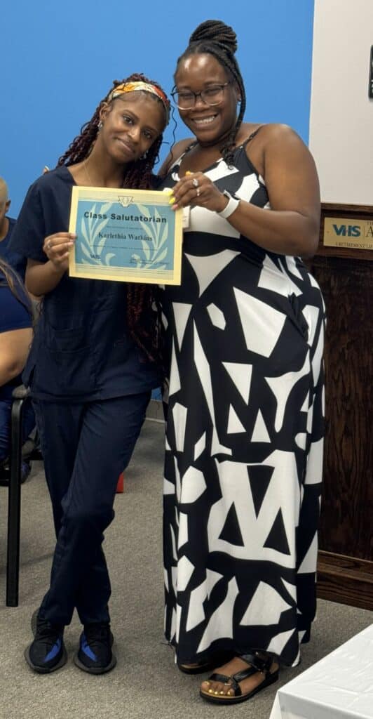 Salutatorian Karlethia Watkins with Director of Education Princess Henderson.