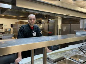 Executive Chef Josh Pittock behind the line at The Arbors Independent Living.