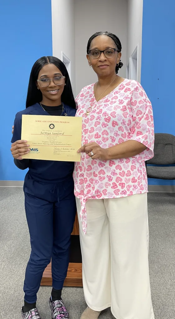 Portrait of JaMya Sanford and instructor Terry Williamson