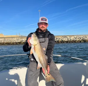 Newport Administrator Stephen Berczek holds a fish